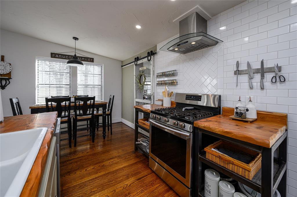 4597 West Line Road Whitesboro, TX 76273 - Photo 18 of 31 a kitchen with a stove and a table