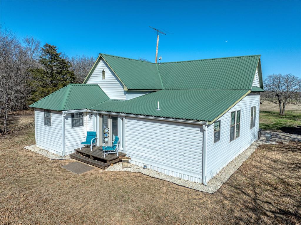 4597 West Line Road Whitesboro, TX 76273 - Photo 7 of 31 a house view with a backyard space