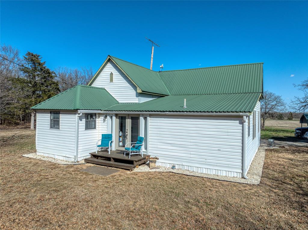 4597 West Line Road Whitesboro, TX 76273 - Photo 8 of 31 a backyard of a house with table and chairs