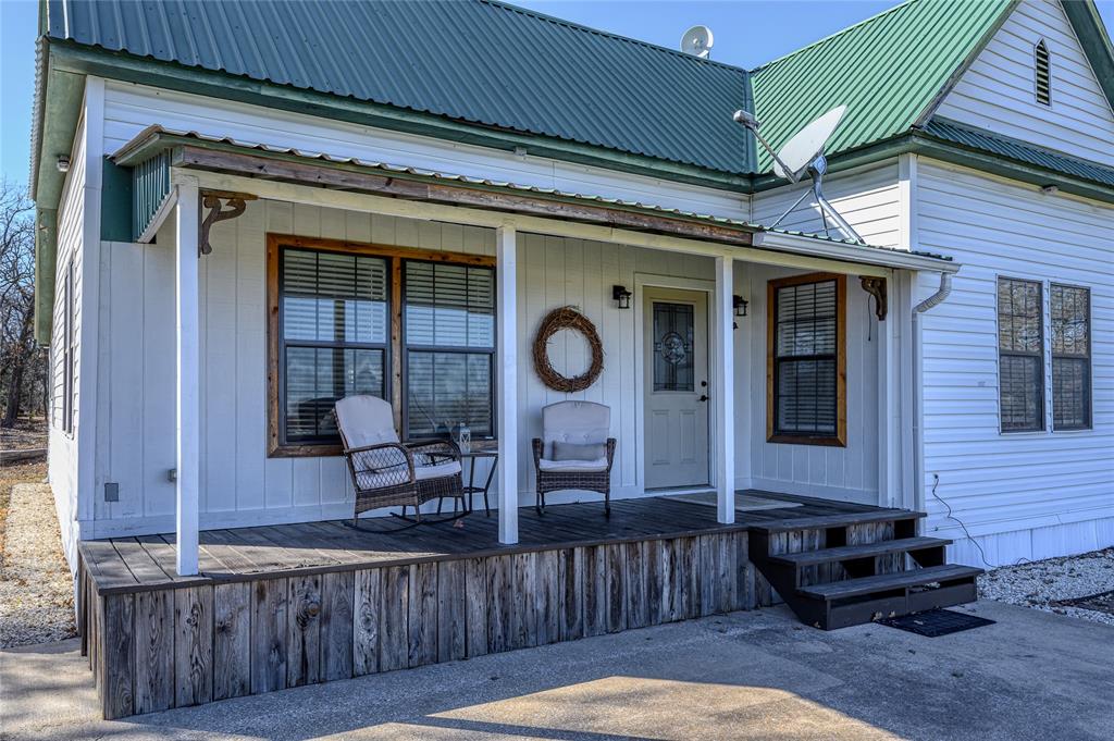 4597 West Line Road Whitesboro, TX 76273 - Photo 9 of 31 a front view of a house with sitting area