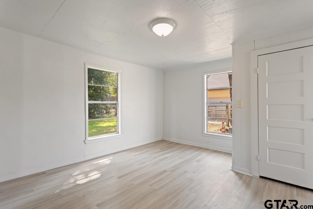 210 Cooper Street Lindale, TX 75771 - Photo 13 of 23 an empty room with windows and closet