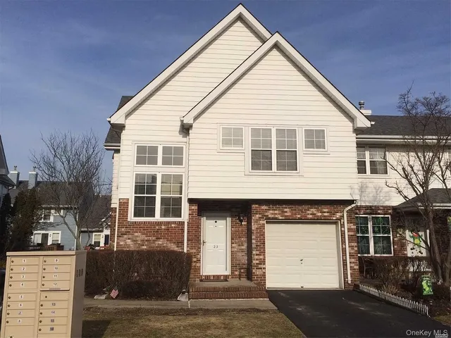 a view of a white house with outdoor space