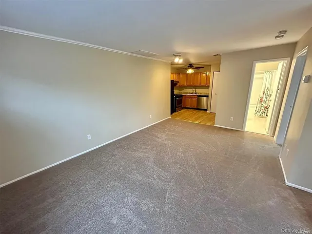 a view of an empty room with a window