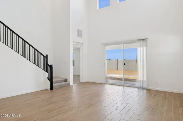 a kitchen with stainless steel appliances a stove top oven a sink and a refrigerator