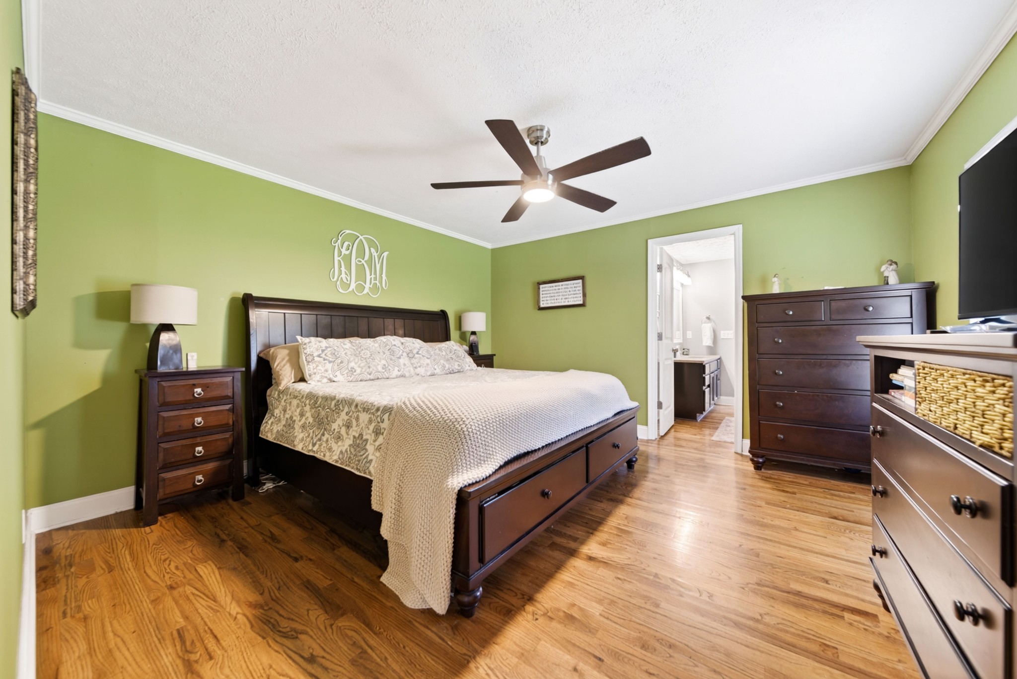 8023 Bethlehem Road Springfield, TN 37172 - Photo 38 of 55 a bedroom with a bed and wooden floor
