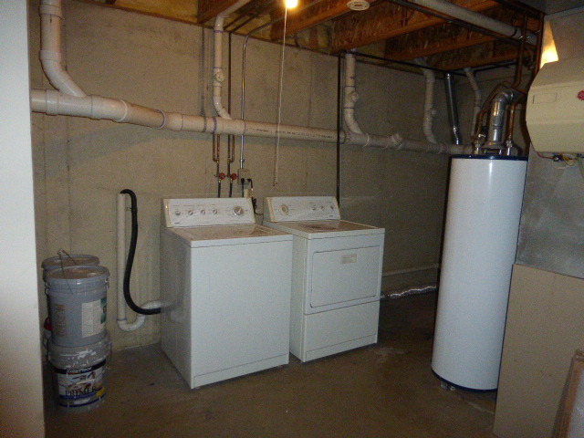 5614 Elizabeth Place, Unit 102 Rolling Meadows, IL 60008 - Photo 18 of 22 a utility room with dryer and washer