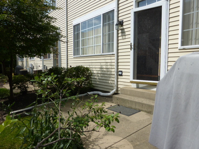 5614 Elizabeth Place, Unit 102 Rolling Meadows, IL 60008 - Photo 19 of 22 a view of a backyard with sitting area