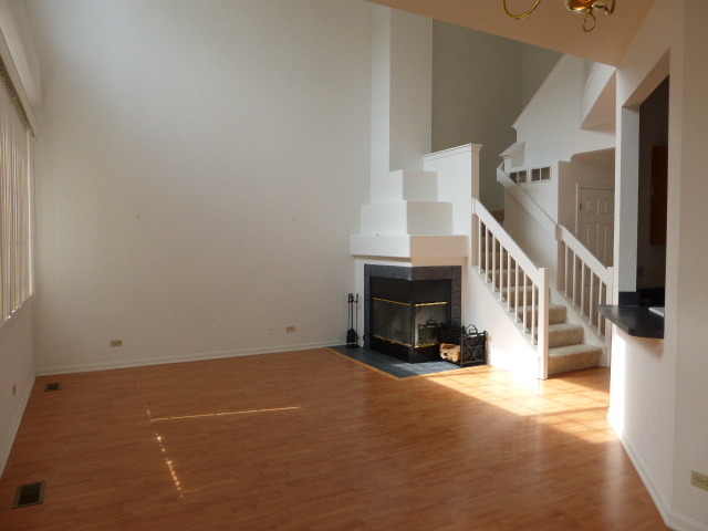 5614 Elizabeth Place, Unit 102 Rolling Meadows, IL 60008 - Photo 4 of 22 a view of an empty room with stairs