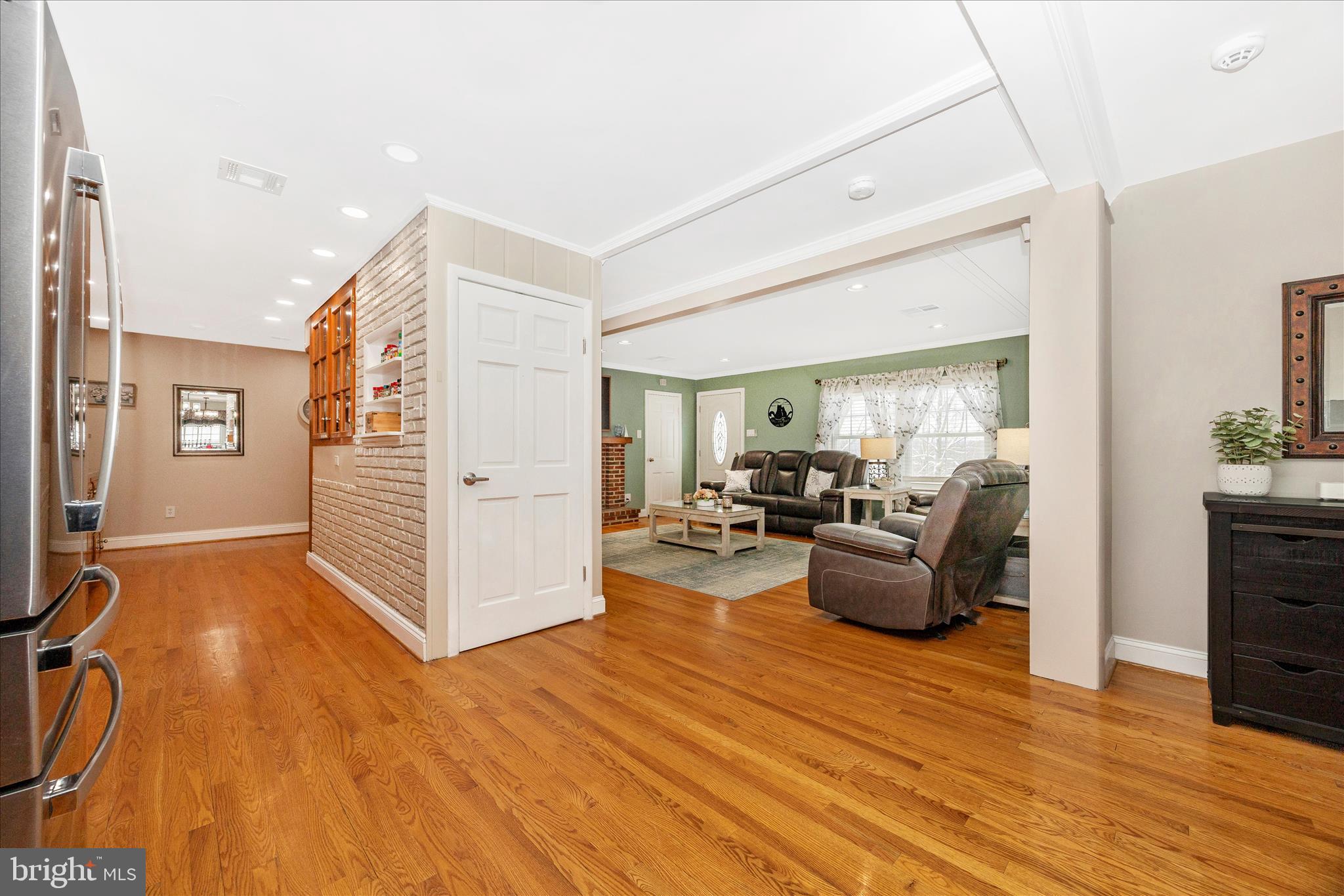 1676 Monument Road Middletown, MD 21769 - Photo 11 of 61 a living room with furniture and a flat screen tv