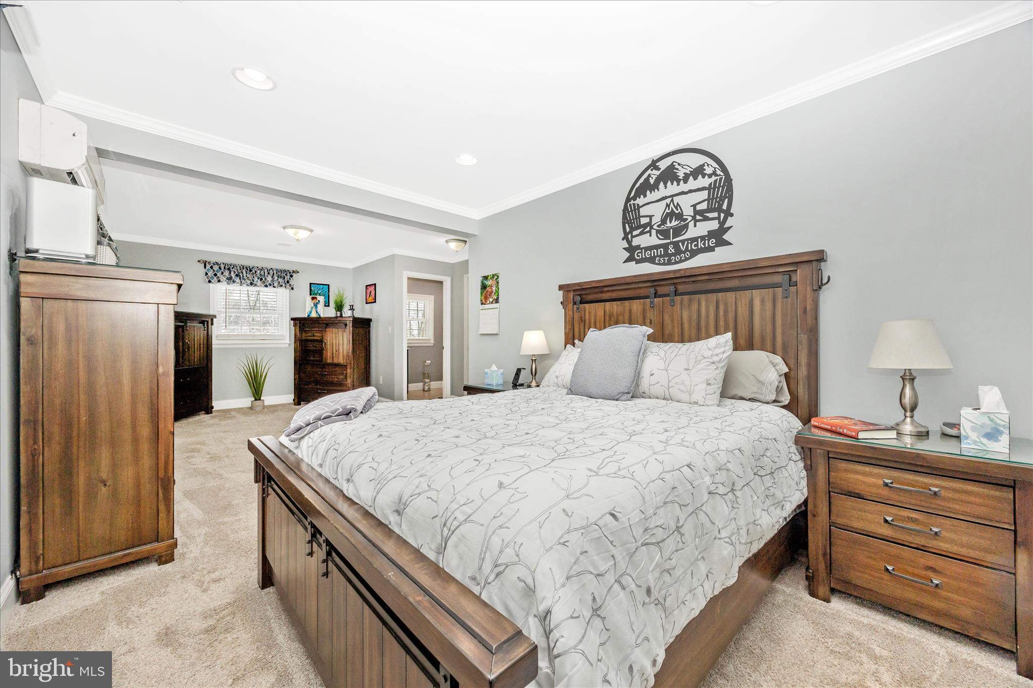 1676 Monument Road Middletown, MD 21769 - Photo 17 of 61 a spacious bedroom with a bed and a dresser in it