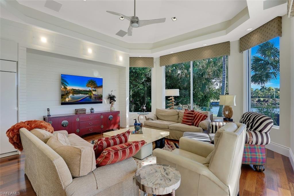 2343 Alexander Palm Naples, FL 34105 - Photo 13 of 35 a living room with furniture and a flat screen tv