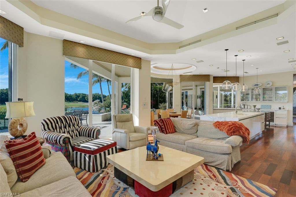 2343 Alexander Palm Naples, FL 34105 - Photo 16 of 35 a living room with furniture and a large window