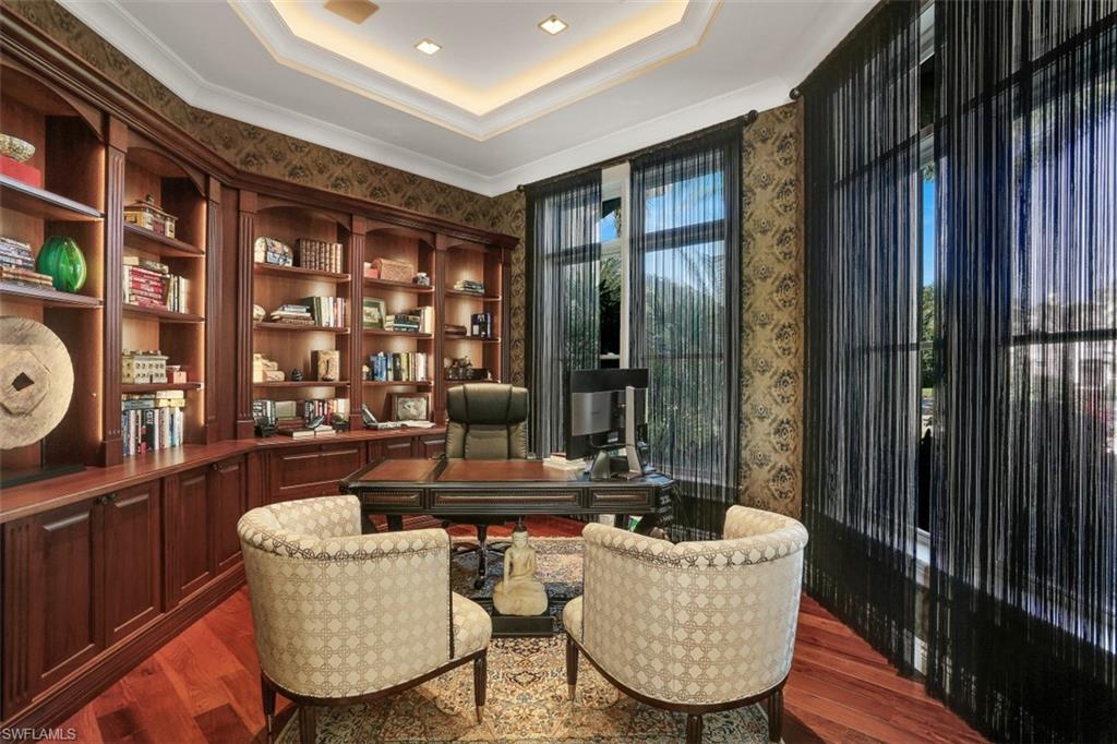 2343 Alexander Palm Naples, FL 34105 - Photo 20 of 35 a living room with furniture and a floor to ceiling window