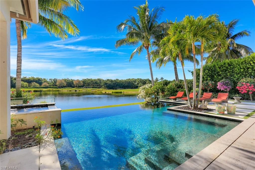 2343 Alexander Palm Naples, FL 34105 - Photo 2 of 35 a view of a lake with houses