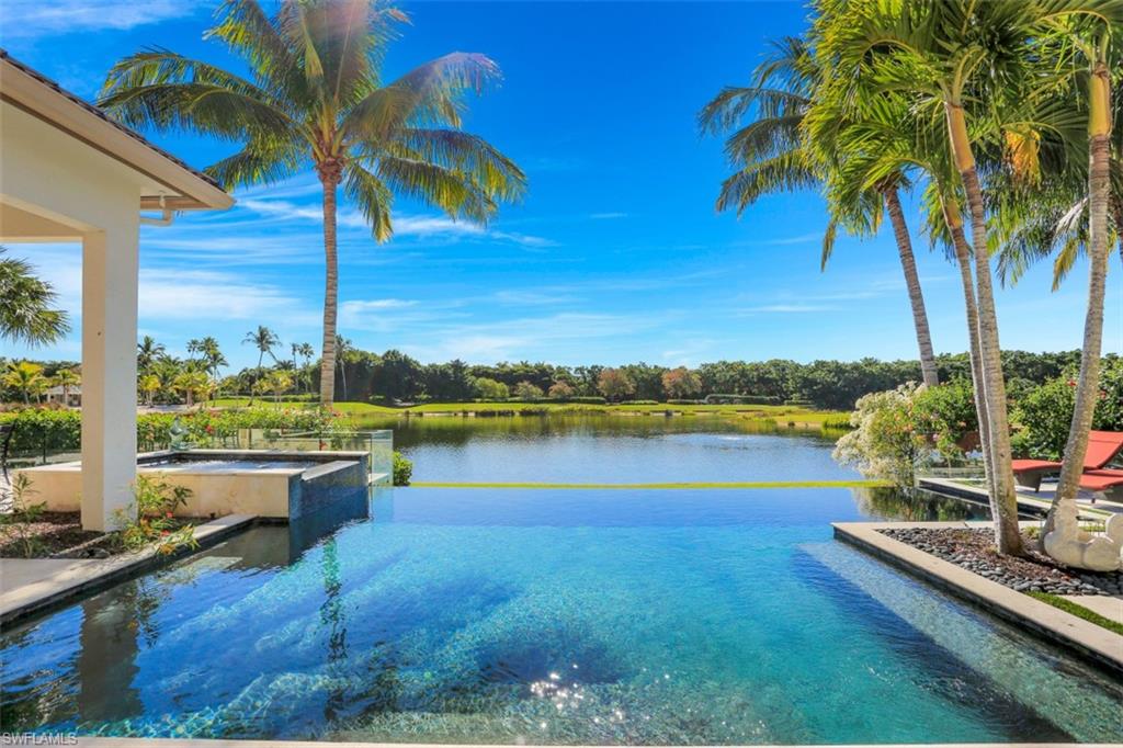 2343 Alexander Palm Naples, FL 34105 - Photo 29 of 35 a view of a lake with couches in the patio