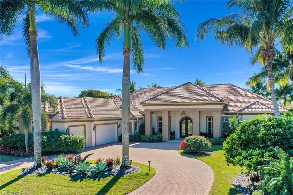 2343 Alexander Palm Naples, FL 34105 - Photo 34 of 35 a front view of a house with garden