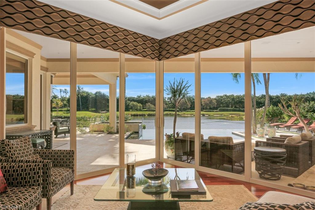 2343 Alexander Palm Naples, FL 34105 - Photo 6 of 35 a room with pool table and glass windows