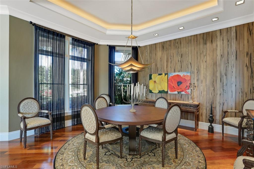 2343 Alexander Palm Naples, FL 34105 - Photo 8 of 35 a view of a dining room with furniture window and wooden floor