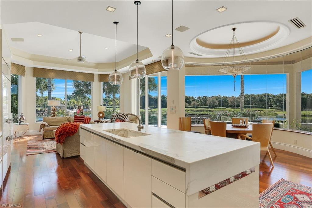 2343 Alexander Palm Naples, FL 34105 - Photo 10 of 35 a very nice looking dining room with a large window and a wooden floor