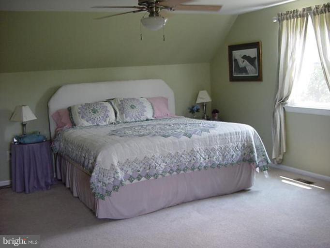 6353 Old Bust Head Road Warrenton, VA 20187 - Photo 13 of 13 a bedroom with a bed and a window