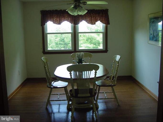 6353 Old Bust Head Road Warrenton, VA 20187 - Photo 9 of 13 a table room with a table chairs and a window