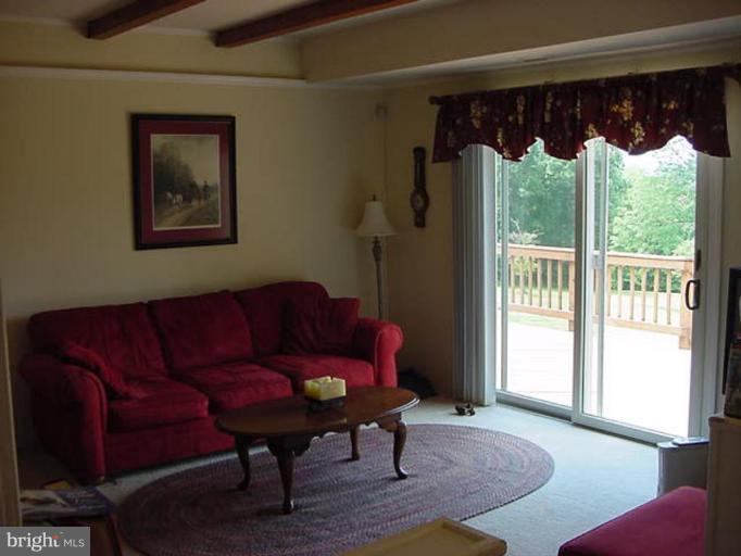 6353 Old Bust Head Road Warrenton, VA 20187 - Photo 10 of 13 a living room with furniture and a large window