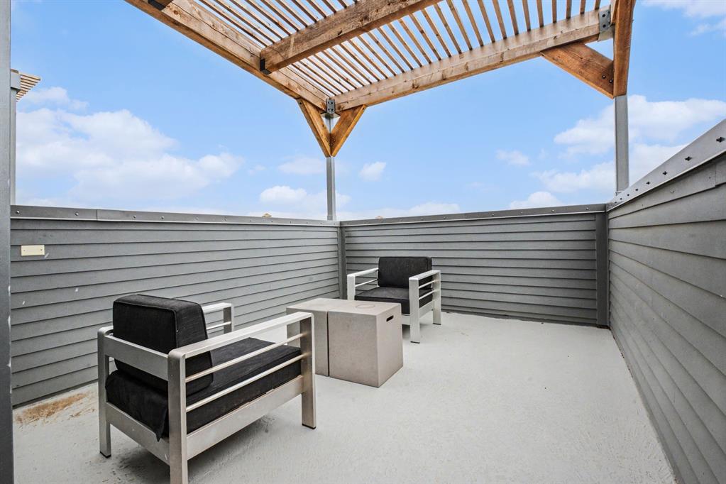 1111 Raiford Road, Unit 121 Carrollton, TX 75007 - Photo 16 of 30 a view of a patio with a table and chairs
