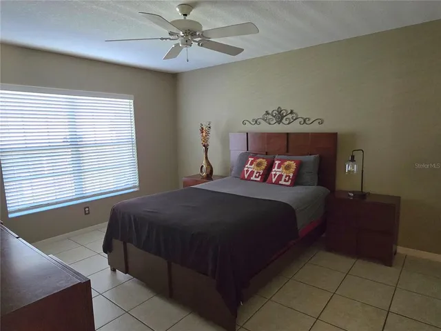 a bedroom with a bed and window