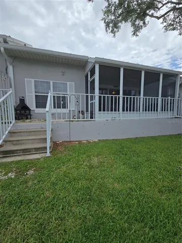 a view of house with yard and porch
