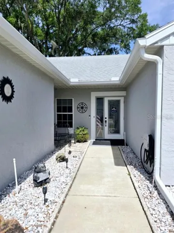 a backyard of a house with seating space