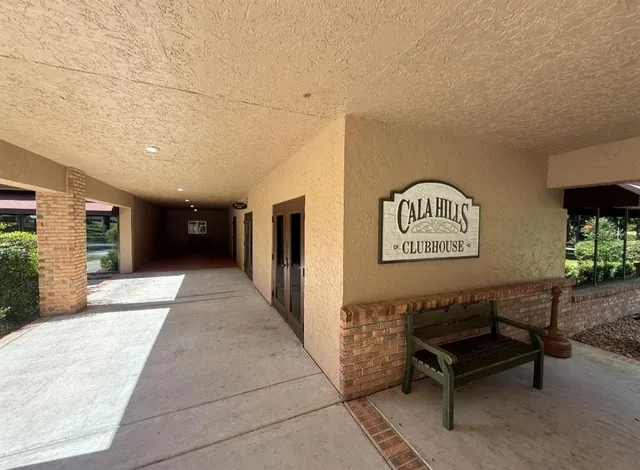 a swimming pool with outdoor seating and yard
