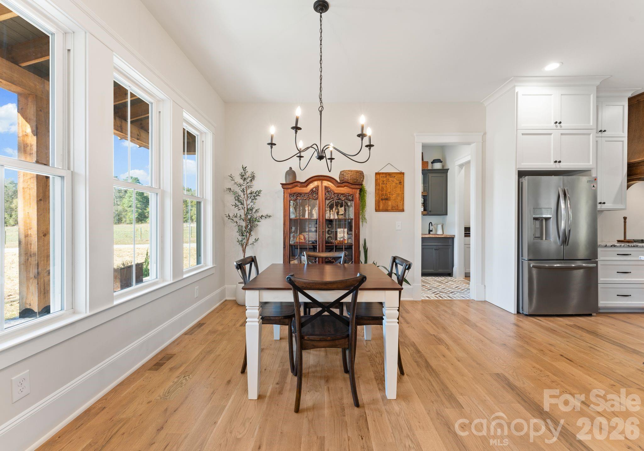 3760 Cappadocia Church Road Polkton, NC 28135 - Photo 12 of 48 a view of a dining room with furniture window and wooden floor