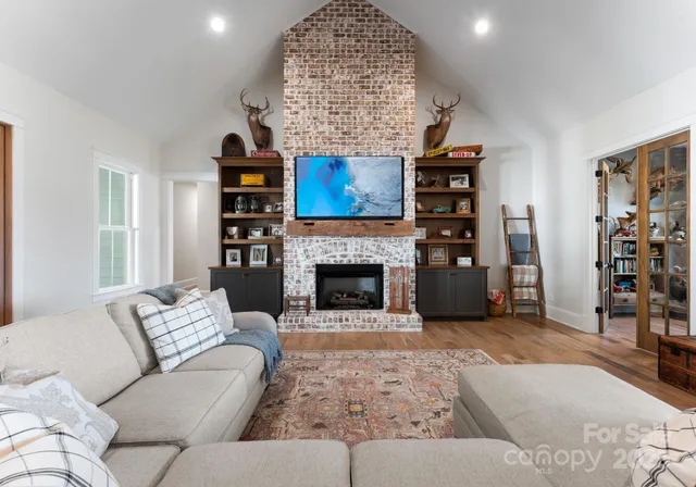 a living room with furniture and a fireplace