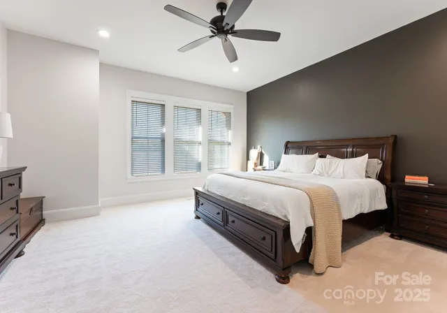 a spacious bedroom with a bed and window