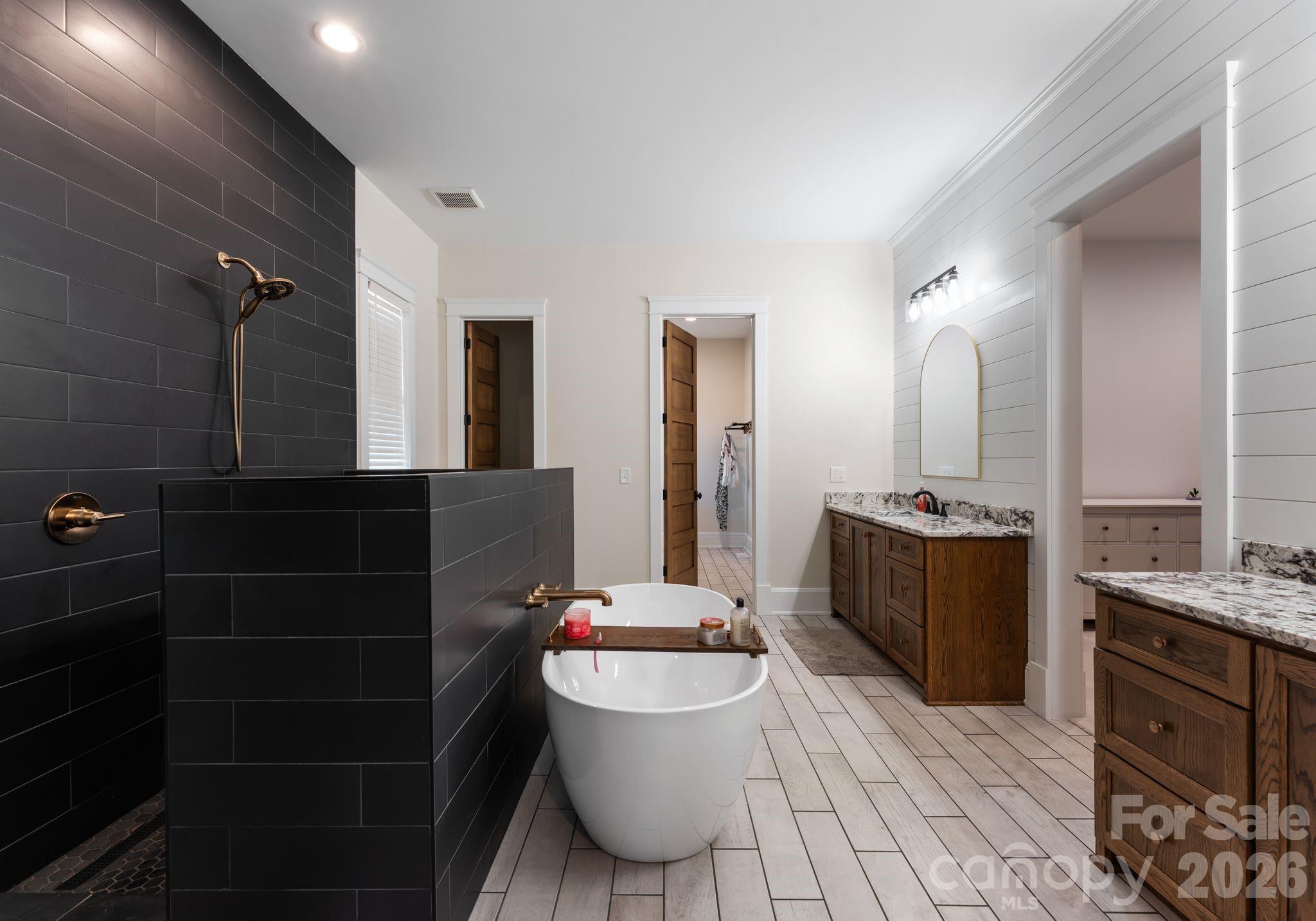 3760 Cappadocia Church Road Polkton, NC 28135 - Photo 23 of 48 a bathroom with a granite countertop sink mirror vanity and toilet