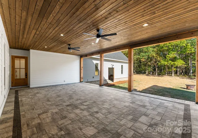 a view of a livingroom with furniture and a garage