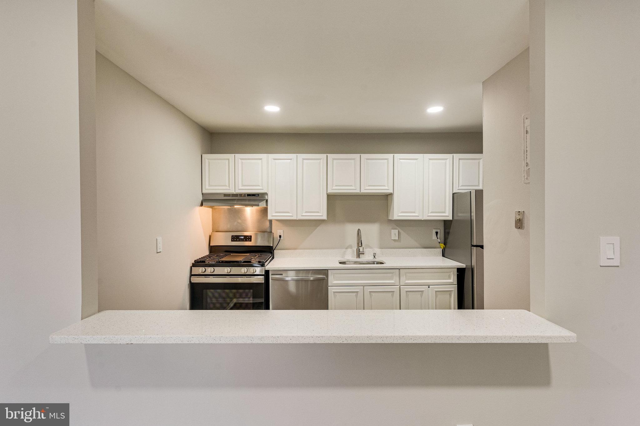 9272 Adelphi Road, Unit 92783 Hyattsville, MD 20783 - Photo 24 of 57 Bar Counter and Opening off of Kitchen