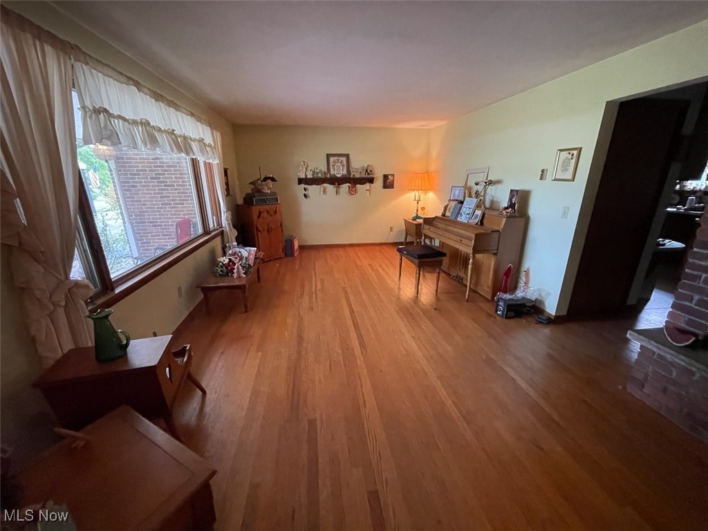 5990 Meese Road Northeast Louisville, OH 44641 - Photo 12 of 16 Living room featuring wood finished floors