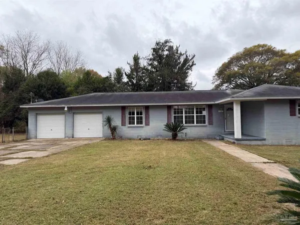 a front view of a house with yard