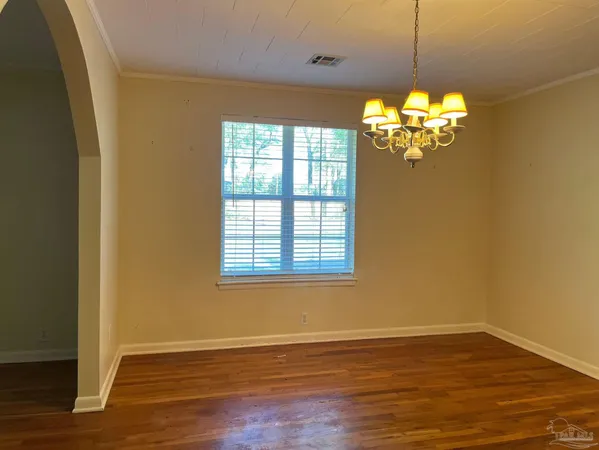 a view of a livingroom with a hardwood floor and a ceiling fan