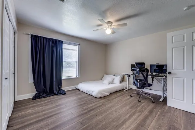 a bedroom with furniture and a window