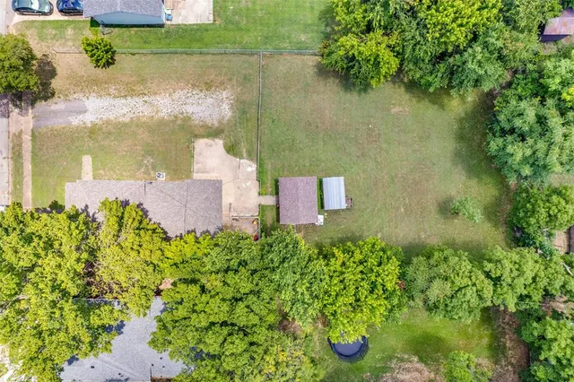 an aerial view of residential house with outdoor space and lake view