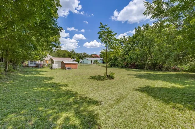a backyard of a house with lots of green space