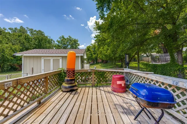 a view of a wooden deck with furniture