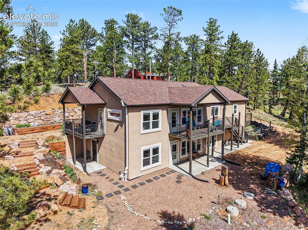 a aerial view of a house with a yard