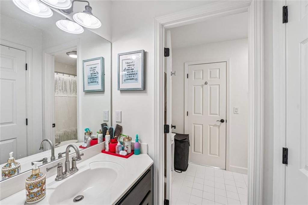 1091 Fieldstone Trail Milton, GA 30004 - Photo 43 of 84 a bathroom with a sink vanity and a mirror