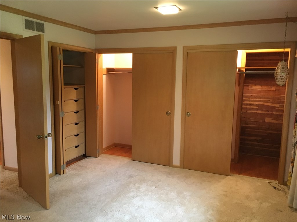 7457 Warren - Sharon Road Brookfield, OH 44403 - Photo 13 of 24 The master bedroom features 3 closets. One closet includes a cedar closet hidden behind a pocket door.