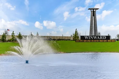 a view of a golf course with a lake