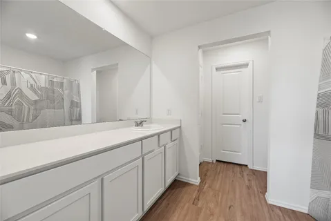 a room with a sink and a mirror