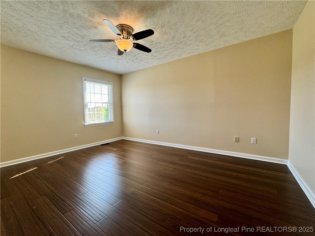 127 Nantahala Drive Linden, NC 28356 - Photo 11 of 22 a view of an empty room with wooden floor and a window